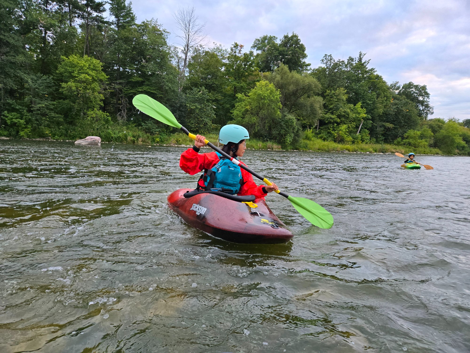 Dr. Irene Chan kayaking on a river in Ontario