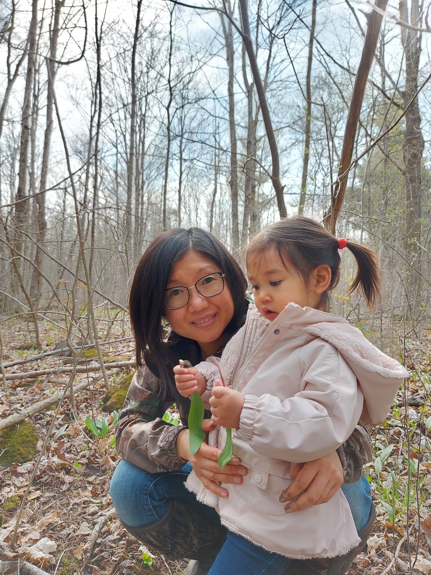 Dr. Irene Chan outdoors with her daughter, exploring nature